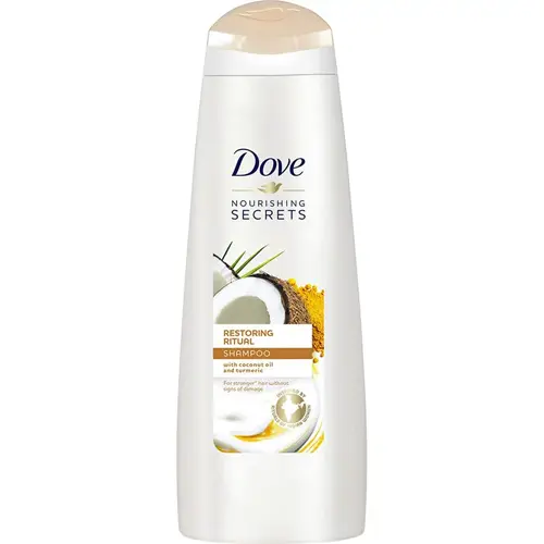 En beige flaska schampo tillverkat av Dove som heter "restoring ritual"