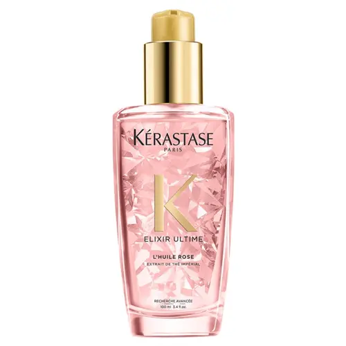En rosa flaska hårolja tillverkad av Kérastase som heter "elixir ultime l'huile rose"