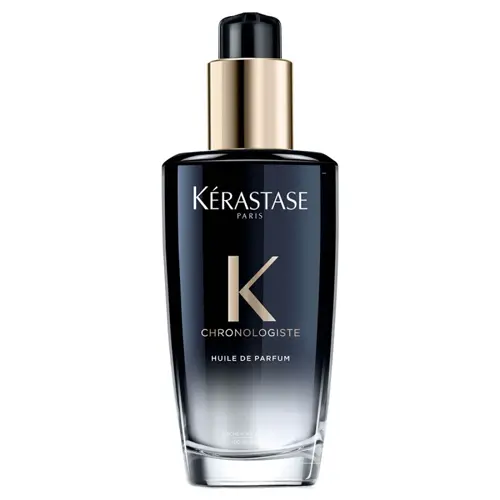 En svart flaska hårolja tillverkad av Kérastase som är parfymerad