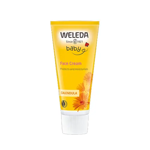 En gul tub med vit kork som innehåller ansiktskräm för barn tillverkad av märket "Weleda" som heter "Calendula face cream"