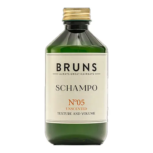 En mörkgrön flaska som innehåller 300 ml oparfymerat schampo tillverkad av märket "Bruns" som heter "No5"