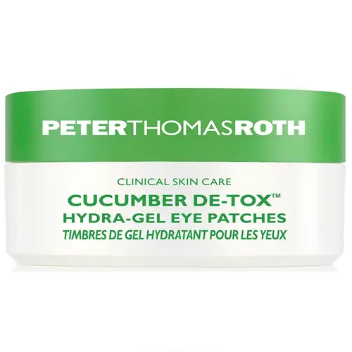 En vit och grön burk med ögonpatches tillverkade av märket "Peter Thomas Roth" som kallas "Cucumber De-Tox"